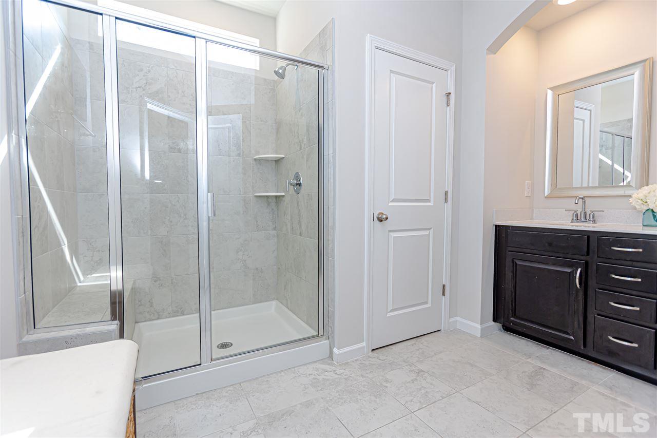 6123 Beale Loop Raleigh, NC 27616 - Photo 20 of 30 a bathroom with a shower and a sink