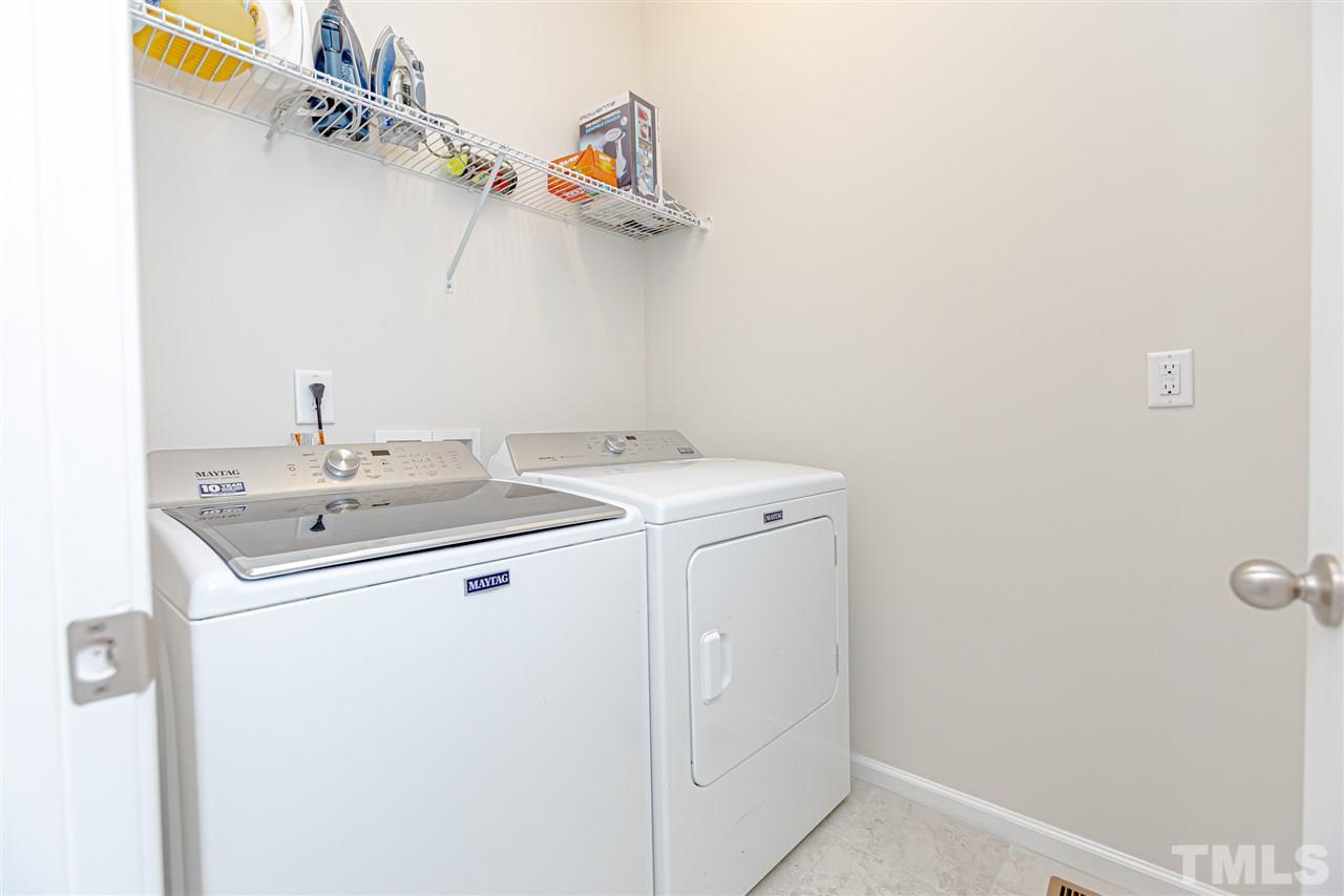 6123 Beale Loop Raleigh, NC 27616 - Photo 22 of 30 a utility room with dryer and washer