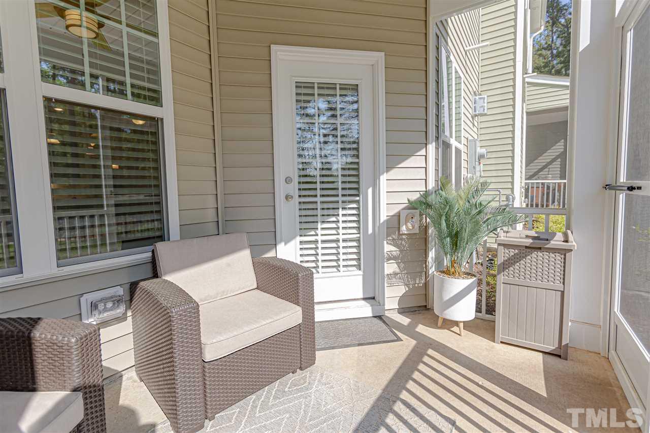 6123 Beale Loop Raleigh, NC 27616 - Photo 27 of 30 a living room with furniture and a potted plant