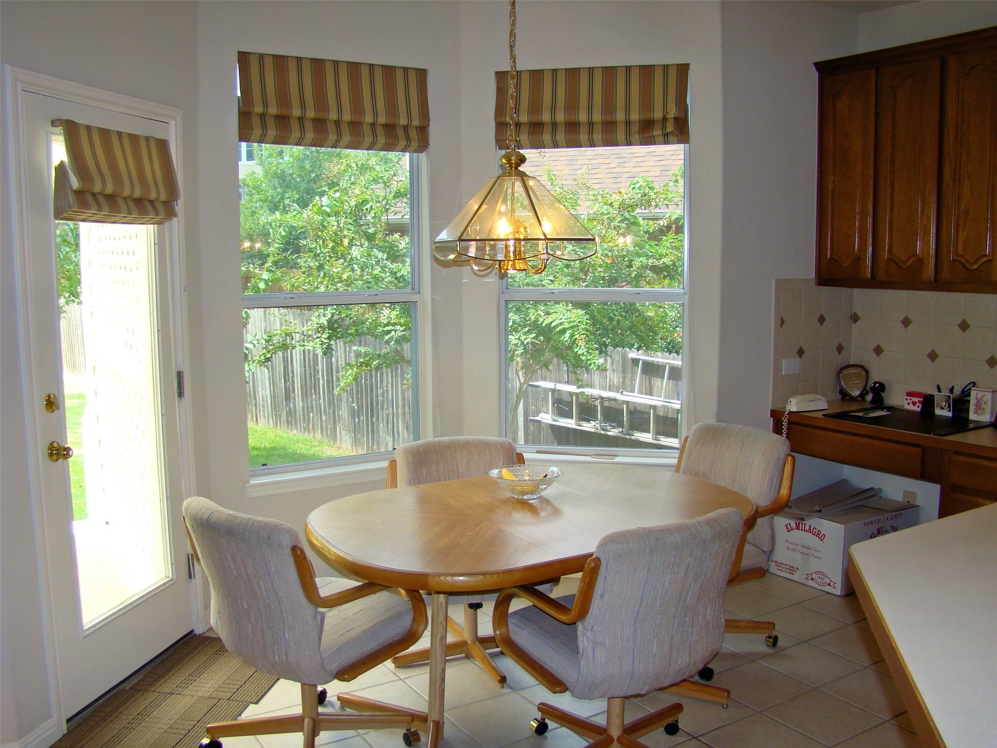 10700 Pointe View Drive Austin, TX 78738 - Photo 6 of 19 a dining room with furniture a rug and wooden floor