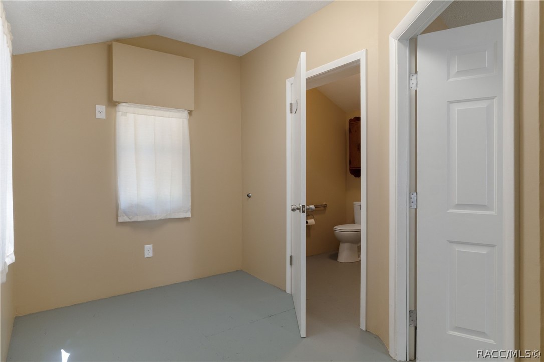 4530 South Florida Avenue Inverness, FL 34450 - Photo 44 of 100 a view of an empty room with closet and a bathroom