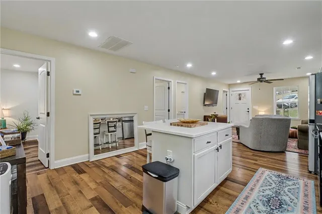 a kitchen with stainless steel appliances a stove a microwave and cabinets