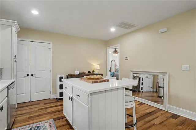 a kitchen with stainless steel appliances a refrigerator stove microwave and sink