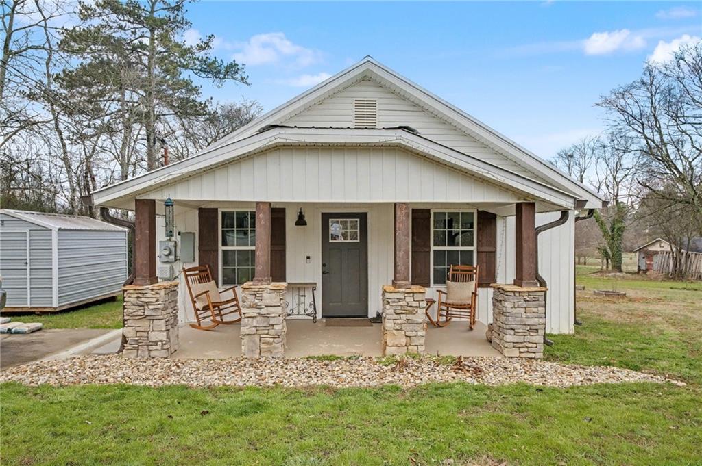 4843 Calhoun Road Northeast Rome, GA 30161 - Photo 2 of 56 a front view of a house with garden