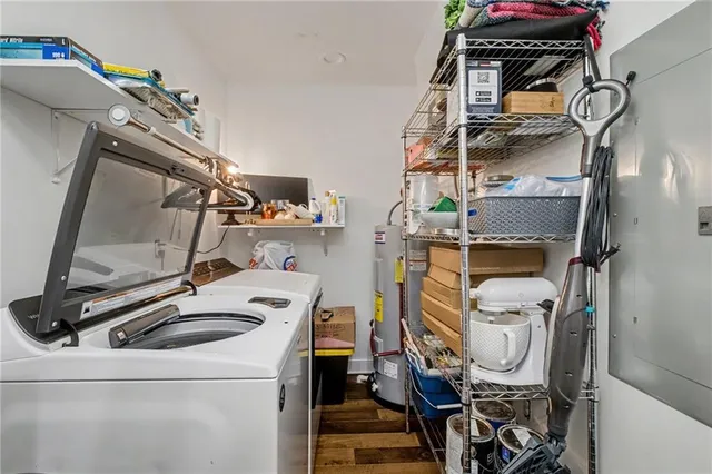 a living room with furniture a flat screen tv and a window