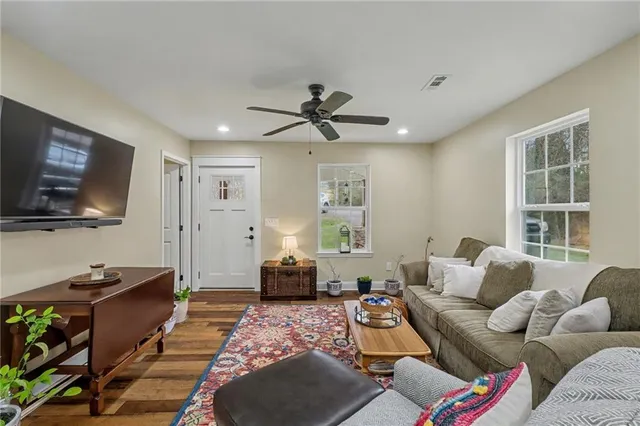 a living room with furniture and a table
