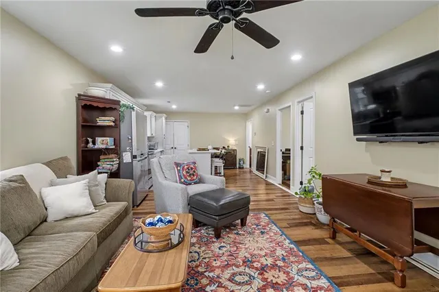 a living room with furniture and a rug
