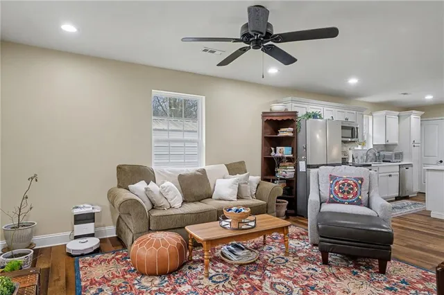a living room with furniture and a rug