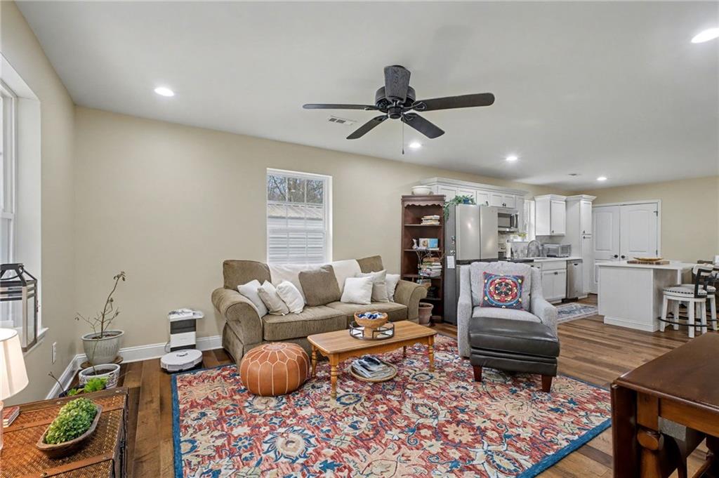 4843 Calhoun Road Northeast Rome, GA 30161 - Photo 30 of 56 a living room with furniture and a rug