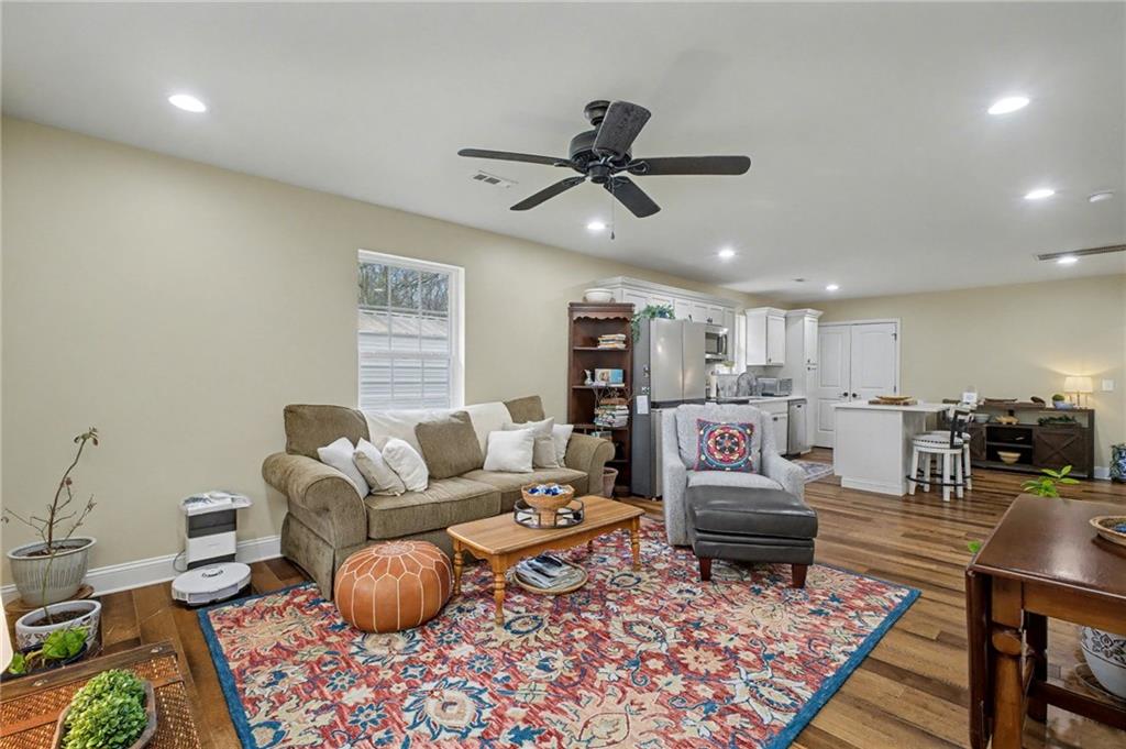 4843 Calhoun Road Northeast Rome, GA 30161 - Photo 31 of 56 a living room with furniture and a rug