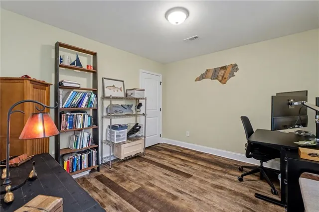 a workspace with furniture and wooden floor