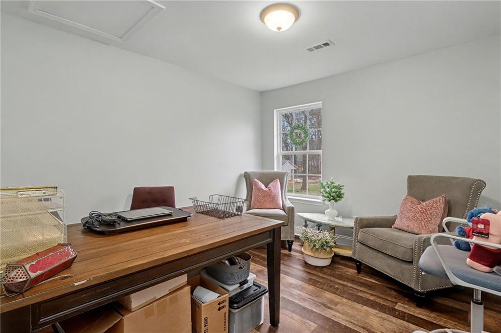 4843 Calhoun Road Northeast Rome, GA 30161 - Photo 36 of 56 a workspace with furniture and wooden floor