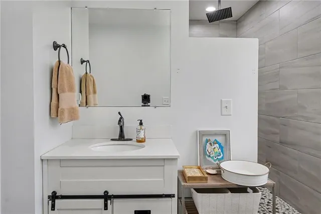 a bathroom with a sink toilet and shower