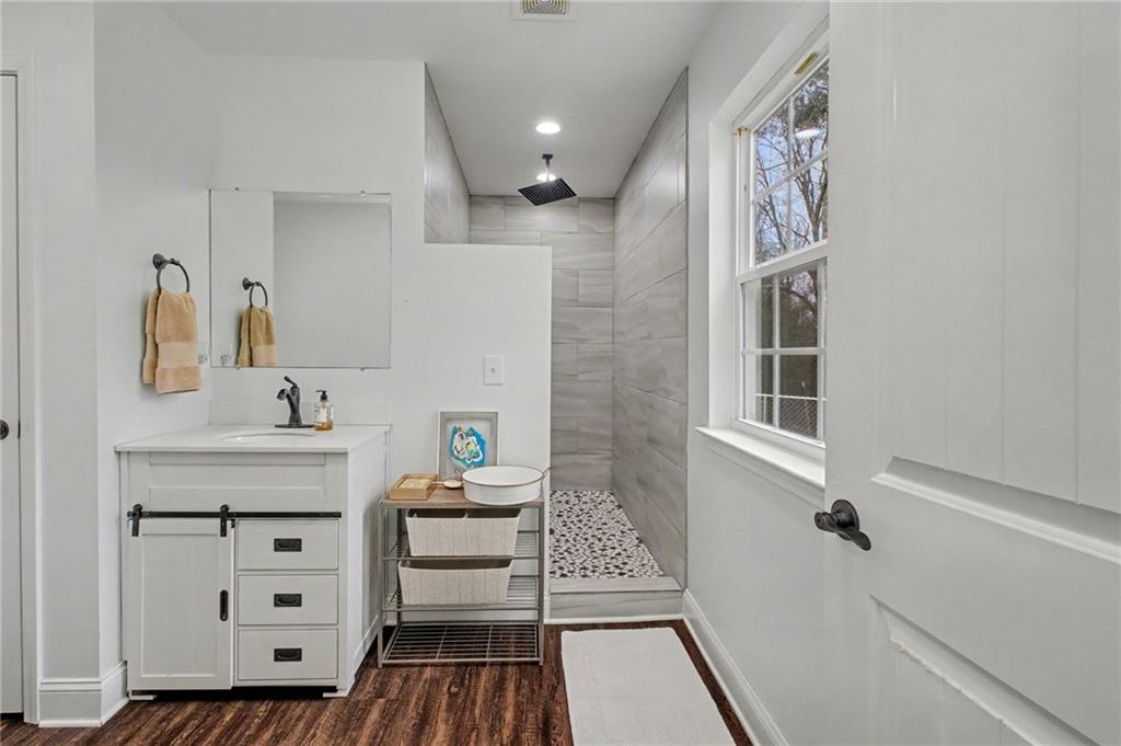 4843 Calhoun Road Northeast Rome, GA 30161 - Photo 41 of 56 a bathroom with a sink toilet and shower