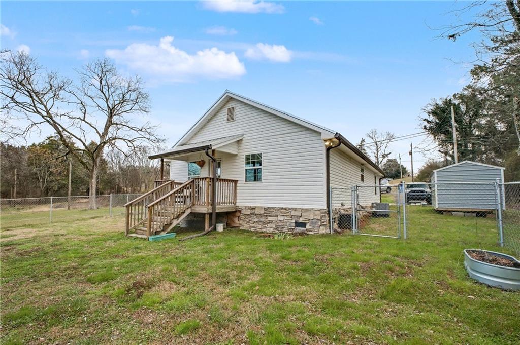 4843 Calhoun Road Northeast Rome, GA 30161 - Photo 46 of 56 a view of a house with backyard