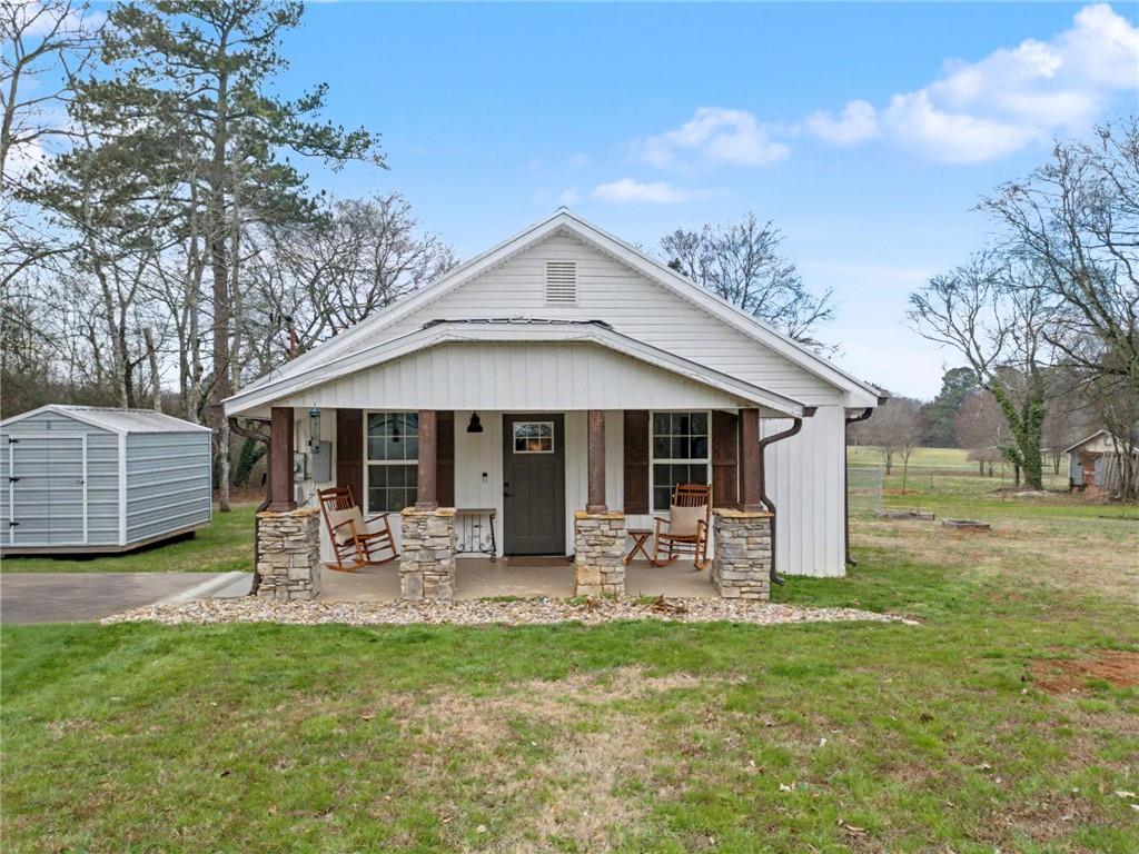 4843 Calhoun Road Northeast Rome, GA 30161 - Photo 55 of 56 a front view of house with yard and seating area