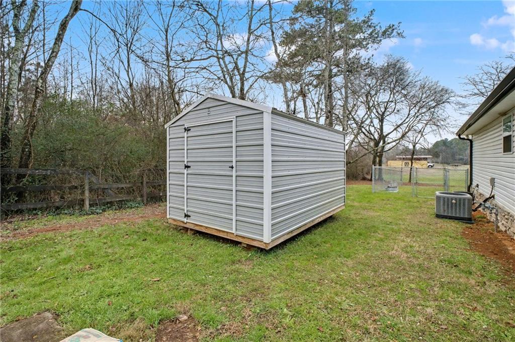 4843 Calhoun Road Northeast Rome, GA 30161 - Photo 56 of 56 a view of a house with a yard and sitting area
