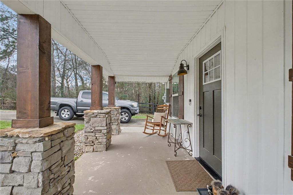 4843 Calhoun Road Northeast Rome, GA 30161 - Photo 8 of 56 a living room with furniture and a large window
