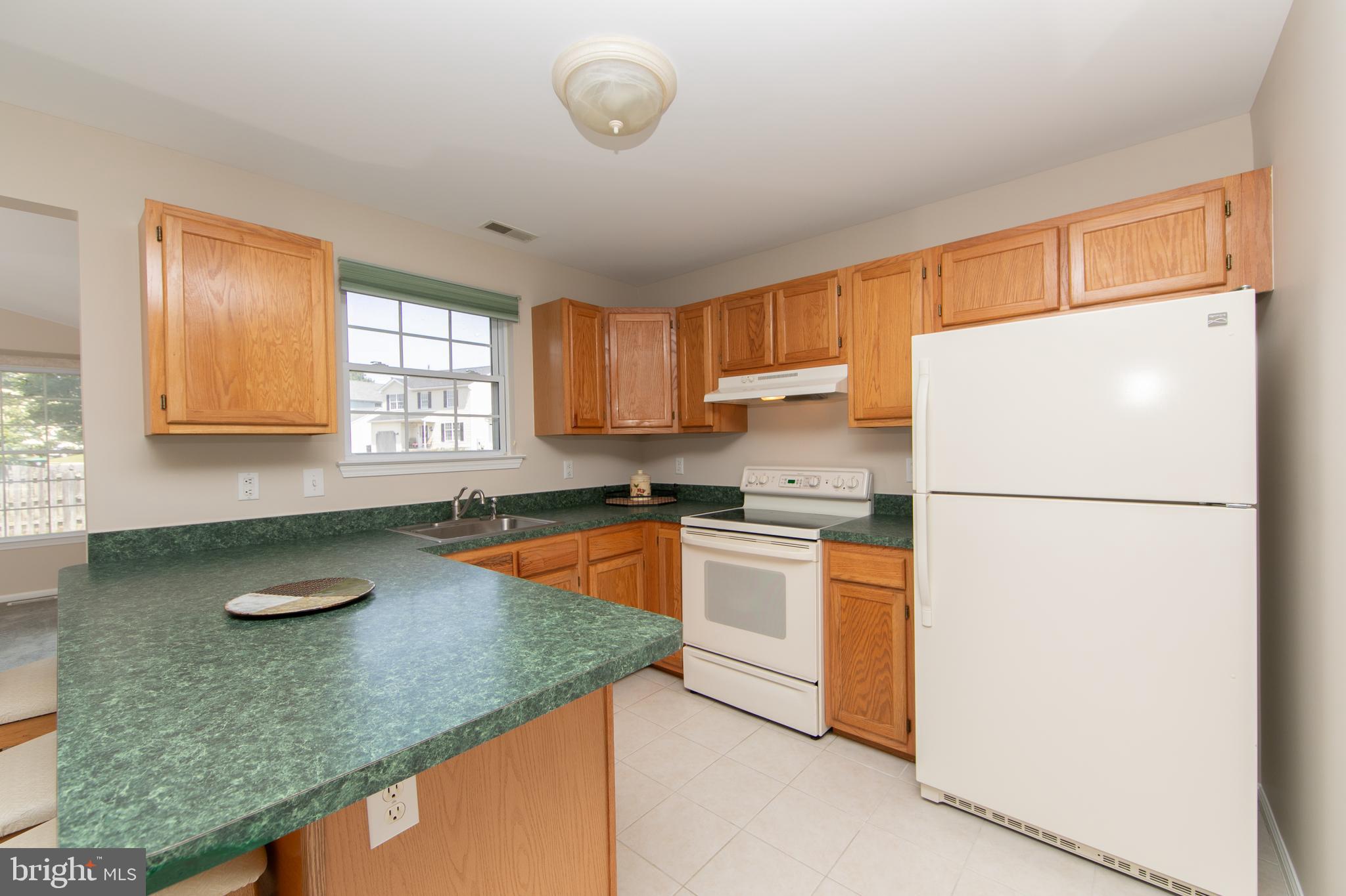37 Wakefield Road Atco, NJ 08004 - Photo 18 of 39 a kitchen with granite countertop stainless steel appliances a refrigerator sink and cabinets
