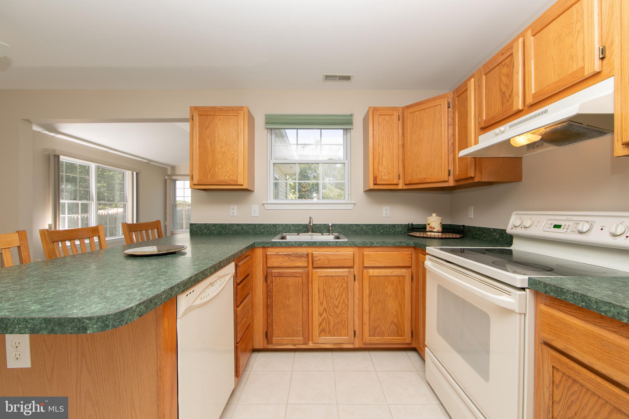 37 Wakefield Road Atco, NJ 08004 - Photo 19 of 39 a kitchen with stainless steel appliances granite countertop a sink stove and cabinets