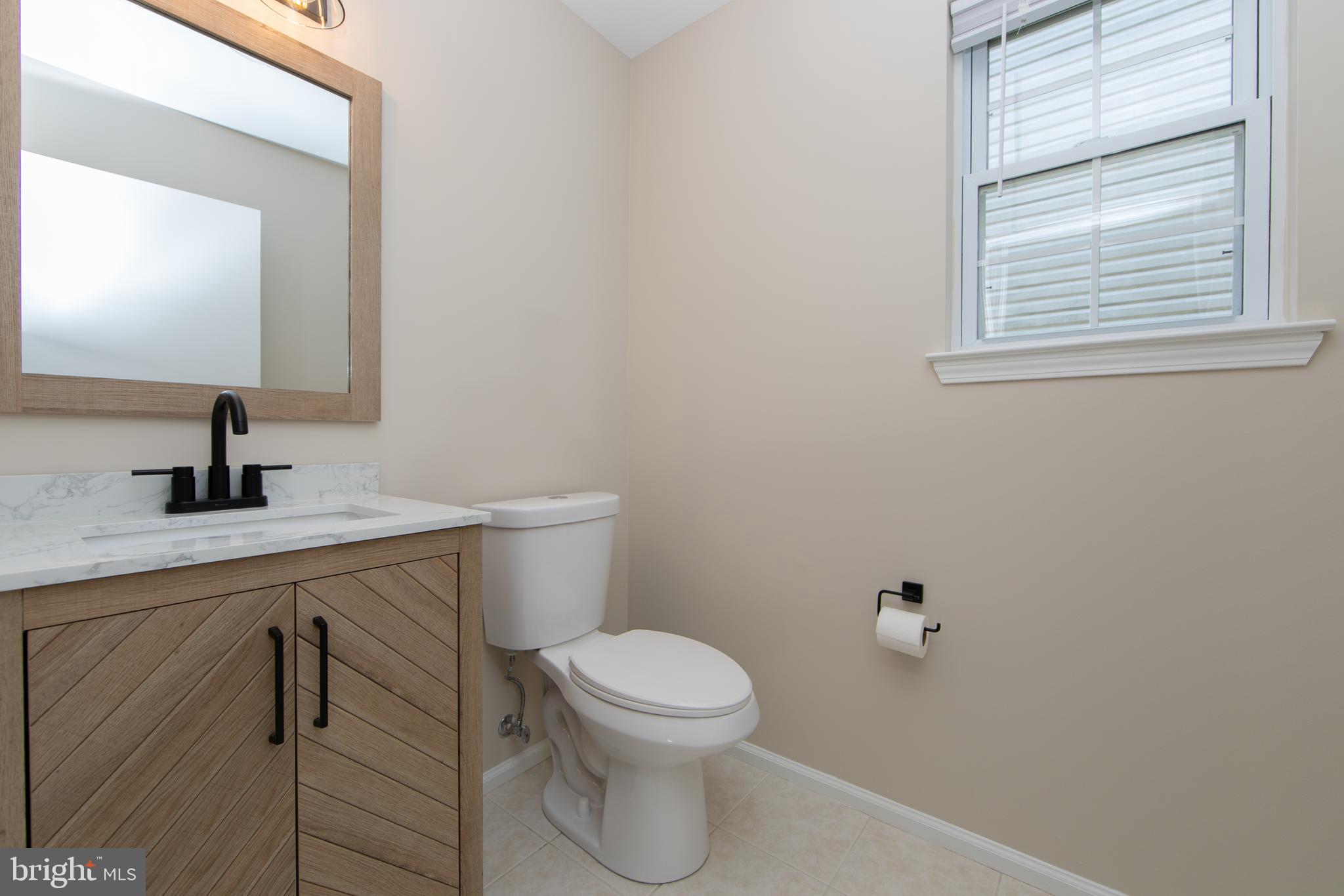 37 Wakefield Road Atco, NJ 08004 - Photo 24 of 39 a bathroom with a toilet a sink and mirror