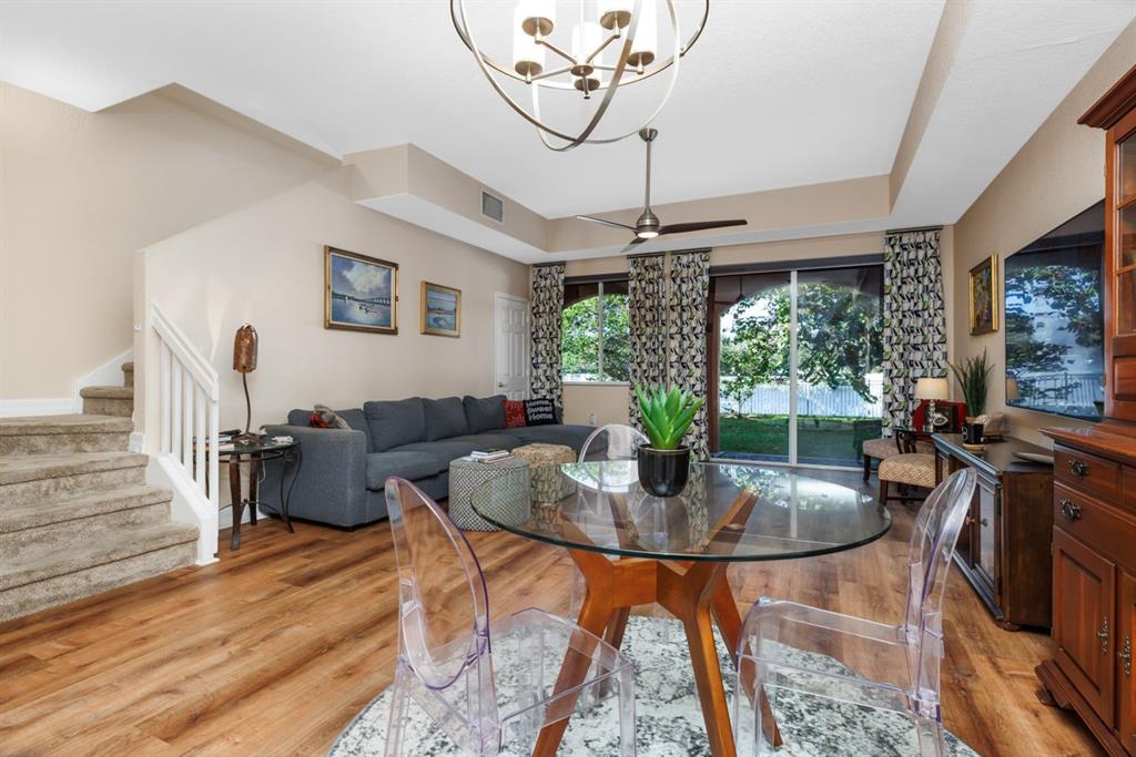 55 Southeast Palermo, Unit 105 Stuart, FL 34994 - Photo 20 of 40 a living room with furniture and a floor to ceiling window