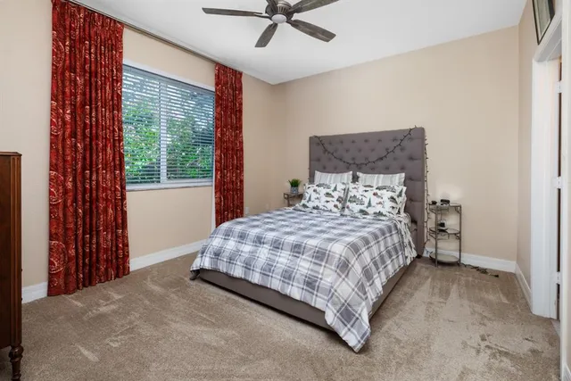 a bedroom with a bed and window