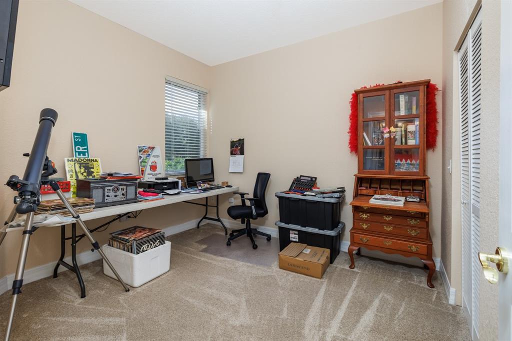 55 Southeast Palermo, Unit 105 Stuart, FL 34994 - Photo 29 of 40 a room with a couch and a table