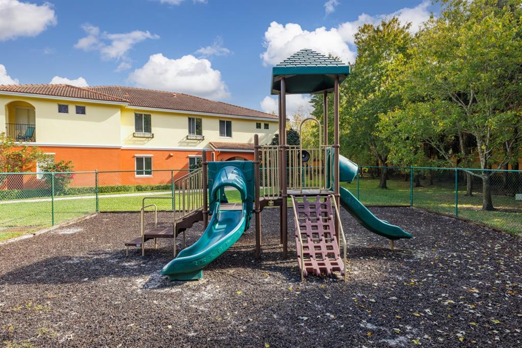 55 Southeast Palermo, Unit 105 Stuart, FL 34994 - Photo 34 of 40 a view of outdoor space with playground and green space