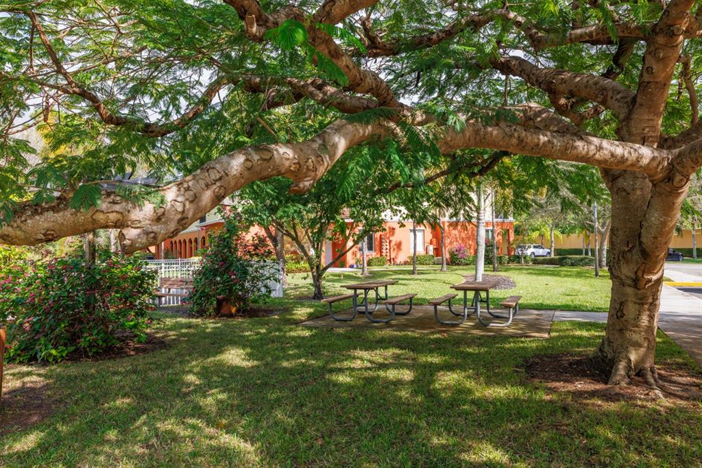 55 Southeast Palermo, Unit 105 Stuart, FL 34994 - Photo 35 of 40 a view of a park with large trees