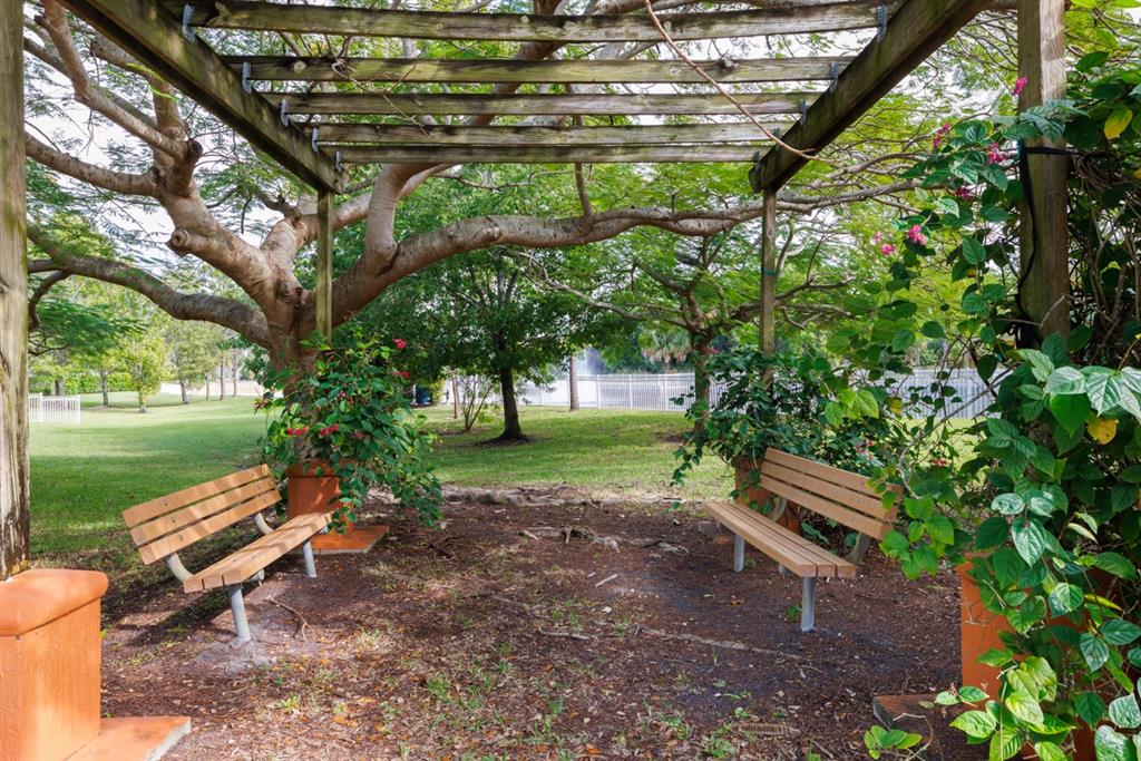 55 Southeast Palermo, Unit 105 Stuart, FL 34994 - Photo 36 of 40 a park with some trees in the background