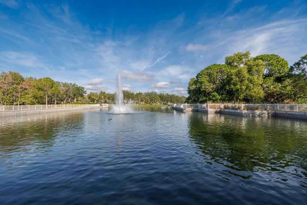 55 Southeast Palermo, Unit 105 Stuart, FL 34994 - Photo 6 of 40 a view of a lake with houses in the back