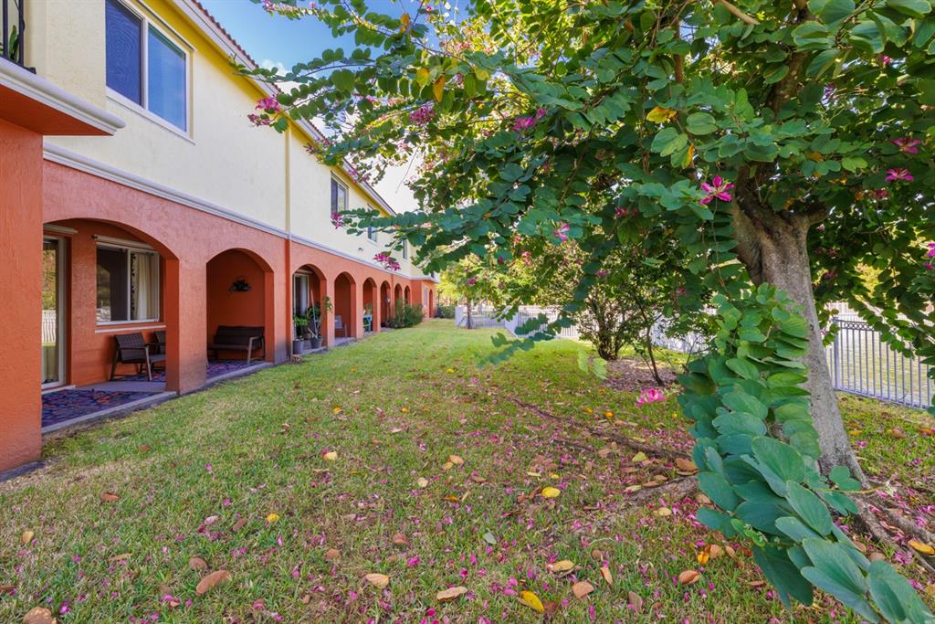 55 Southeast Palermo, Unit 105 Stuart, FL 34994 - Photo 9 of 40 a view of a house with a yard