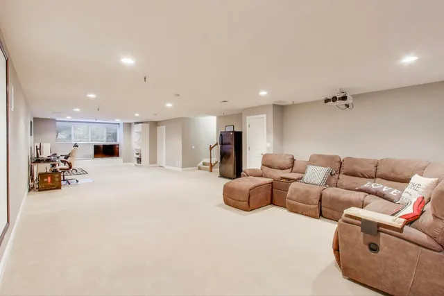 a living room with furniture and gym equipment