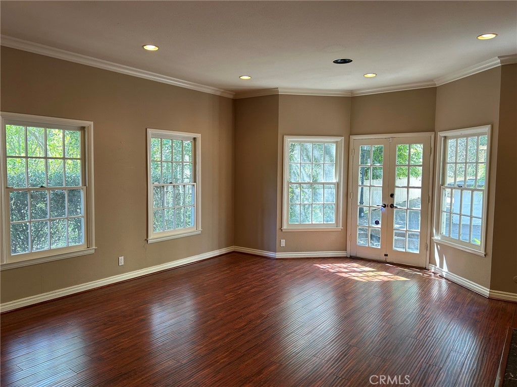 300 South Timken Road Anaheim, CA 92808 - Photo 9 of 40 a view of an empty room with wooden floor and a window