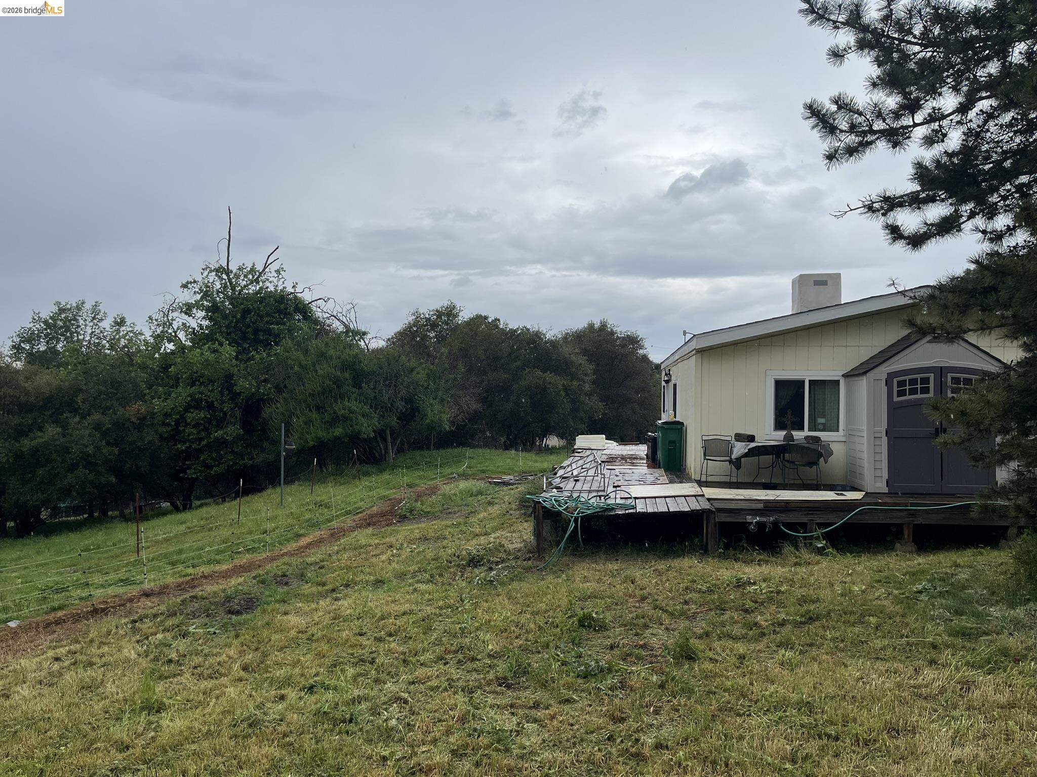 19644 Rawhide Road Sonora, CA 95370 - Photo 11 of 45 View of green lawn with a deck