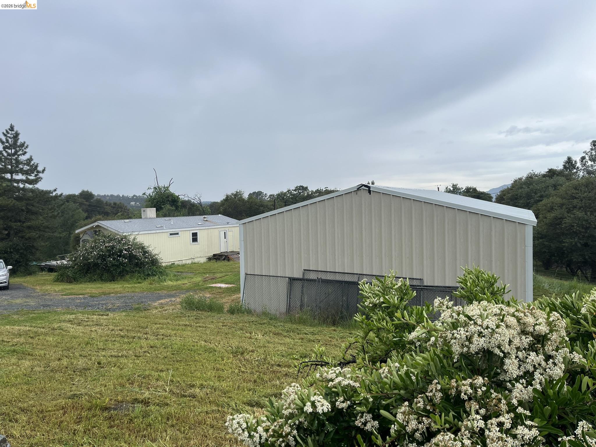 19644 Rawhide Road Sonora, CA 95370 - Photo 5 of 45 View of pole building featuring a yard