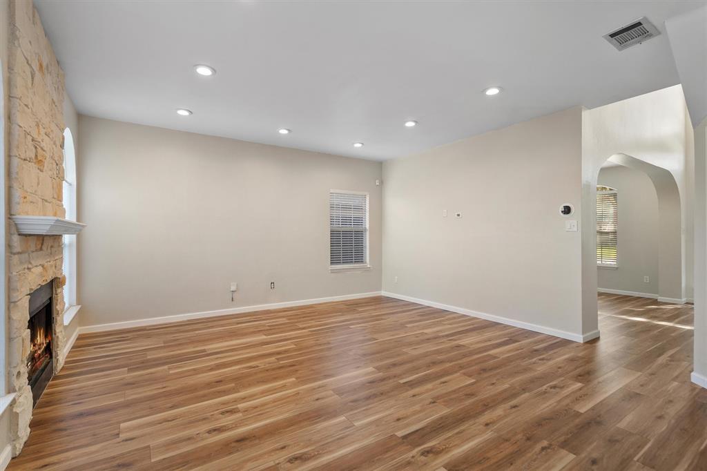 1719 Live Oak Lane Allen, TX 75002 - Photo 12 of 38 an empty room with wooden floor and a window