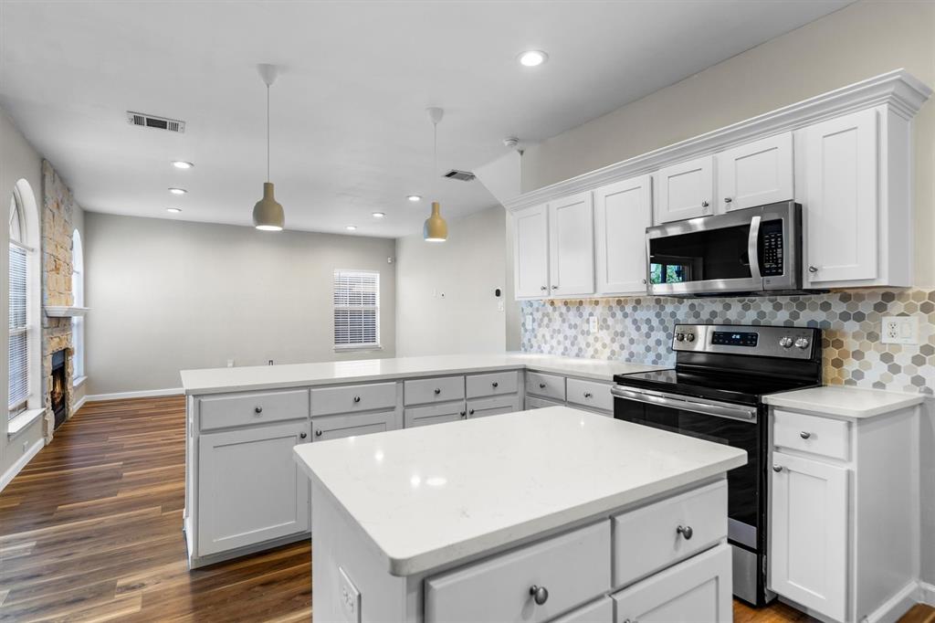 1719 Live Oak Lane Allen, TX 75002 - Photo 18 of 38 a kitchen with a sink stove and microwave