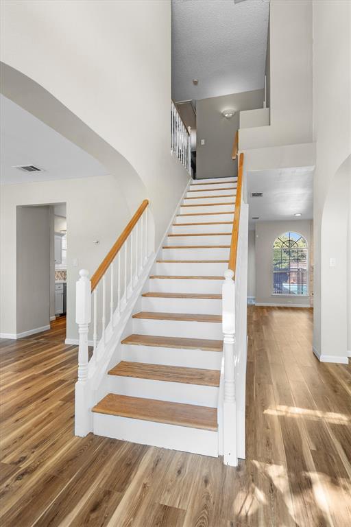 1719 Live Oak Lane Allen, TX 75002 - Photo 23 of 38 a view of entryway and hall with wooden floor