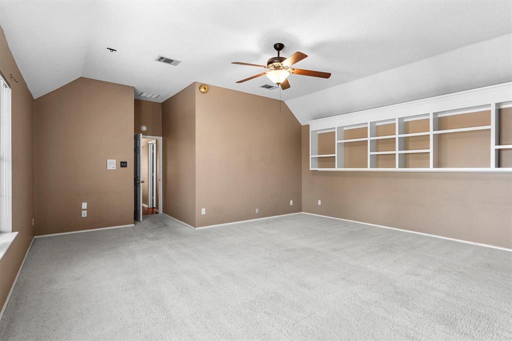 1719 Live Oak Lane Allen, TX 75002 - Photo 25 of 38 a view of an empty room with a ceiling fan