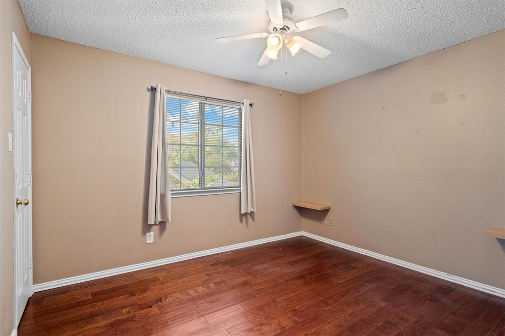 1719 Live Oak Lane Allen, TX 75002 - Photo 32 of 38 wooden floor in an empty room with a window