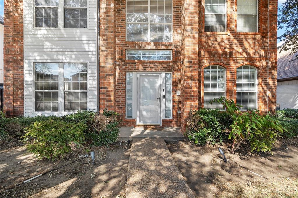 1719 Live Oak Lane Allen, TX 75002 - Photo 4 of 38 a view of a brick building next to a yard