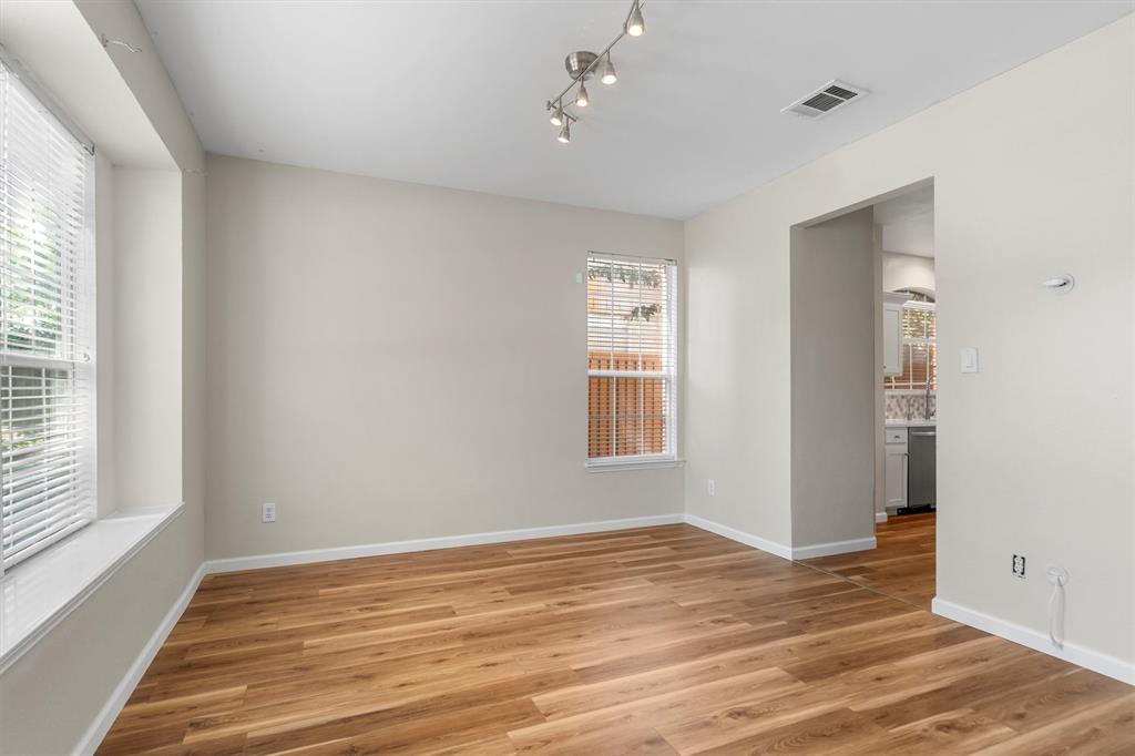 1719 Live Oak Lane Allen, TX 75002 - Photo 8 of 38 a view of empty room with wooden floor and fan