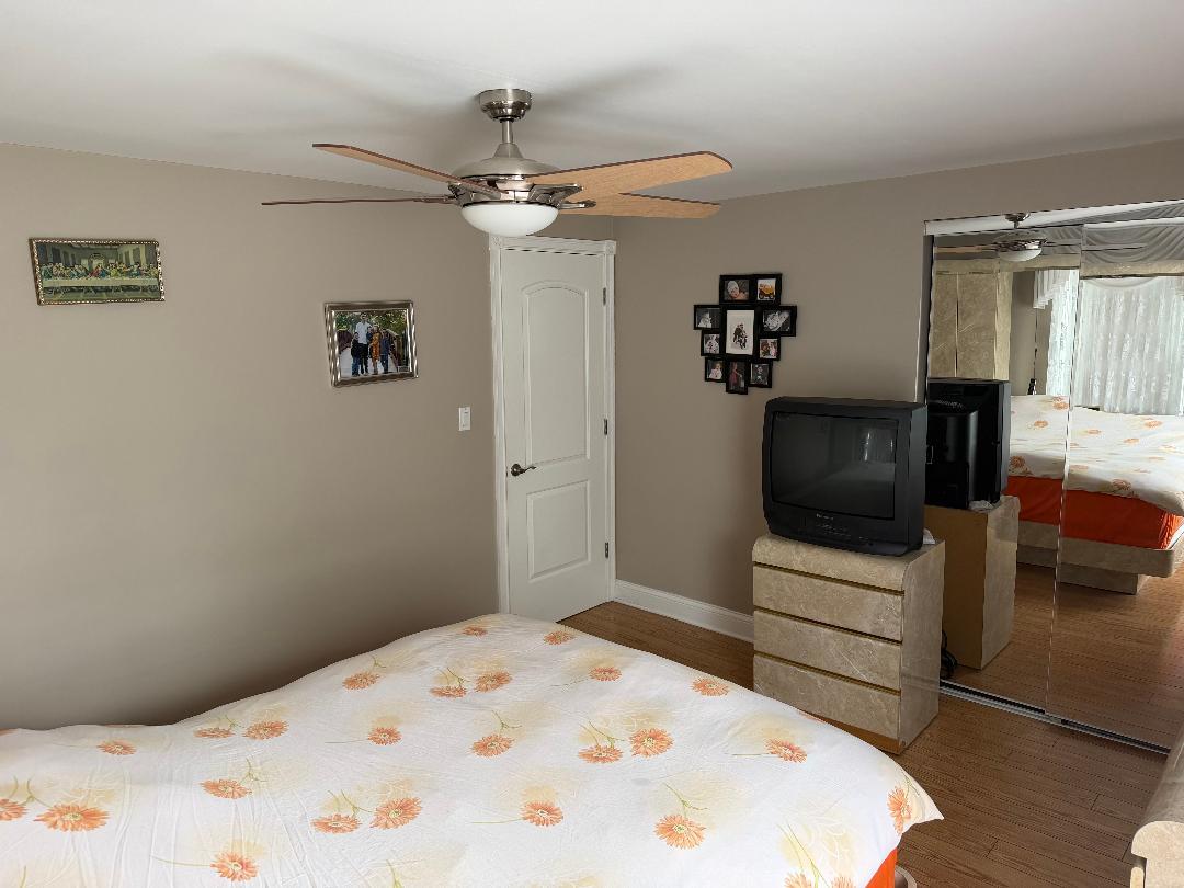 272 West Irving Park Road Wood Dale, IL 60191 - Photo 12 of 12 a bedroom with a bed and a television