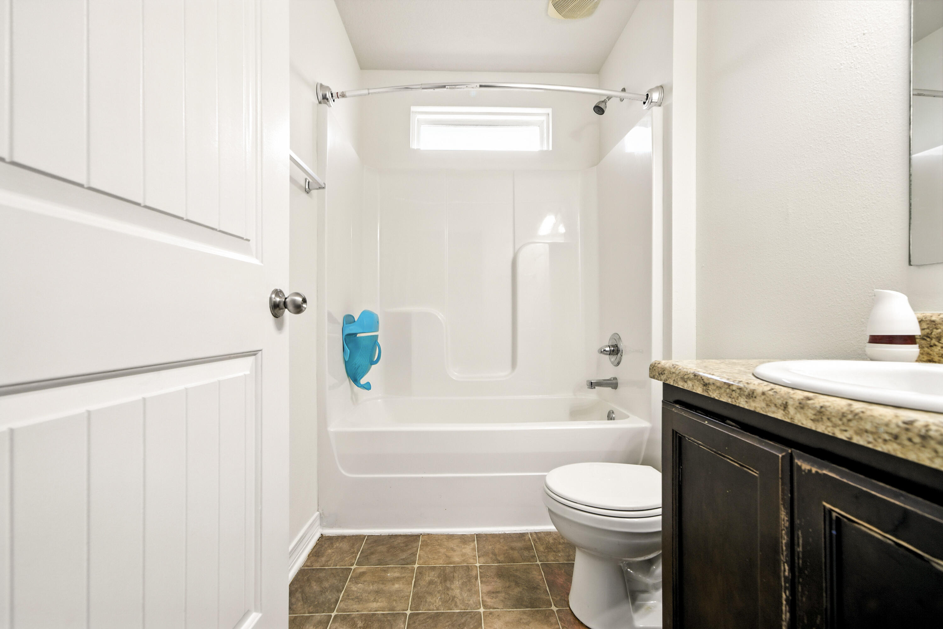 9207 Timber Lane Navarre, FL 32566 - Photo 14 of 24 a bathroom with a granite countertop sink toilet and shower