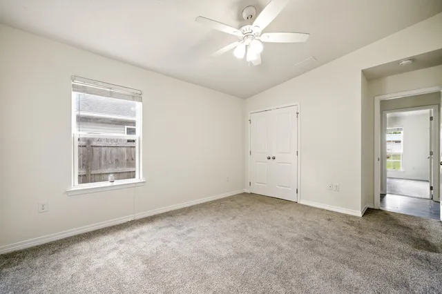 a view of an empty room with a window