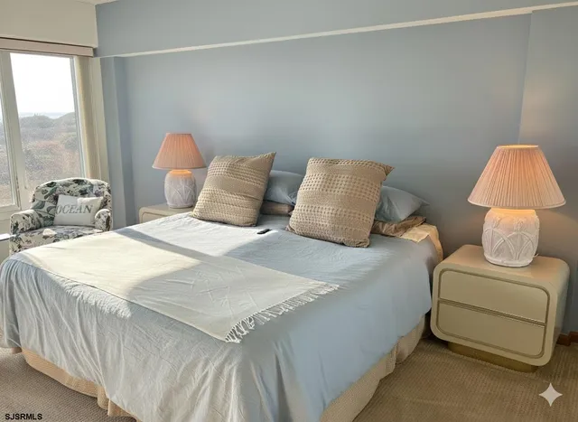 a bedroom with a bed and a chair