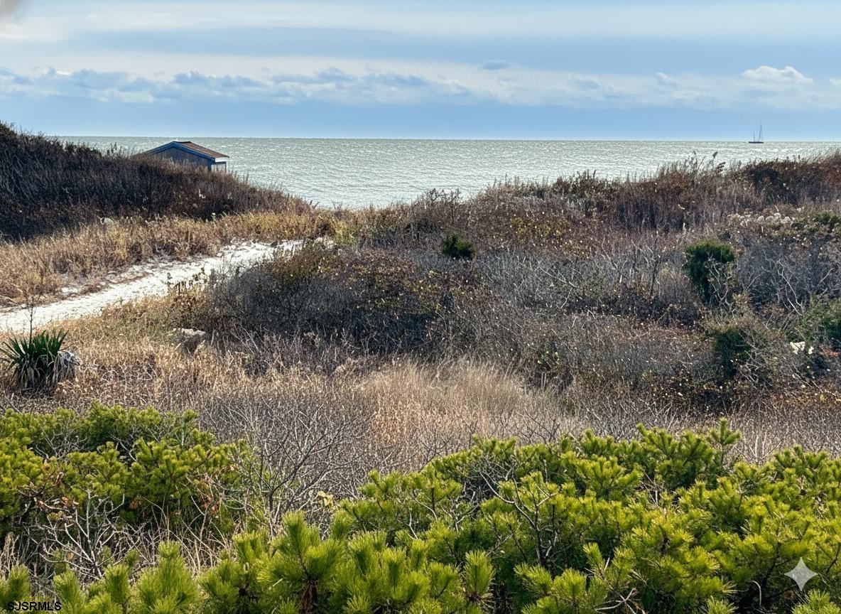 400 West Brigantine Avenue, Unit 2 Brigantine, NJ 08203 - Photo 2 of 24 a view of a lake with mountains in the background