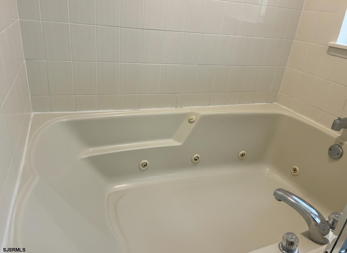 400 West Brigantine Avenue, Unit 2 Brigantine, NJ 08203 - Photo 23 of 24 a close up of a bathtub